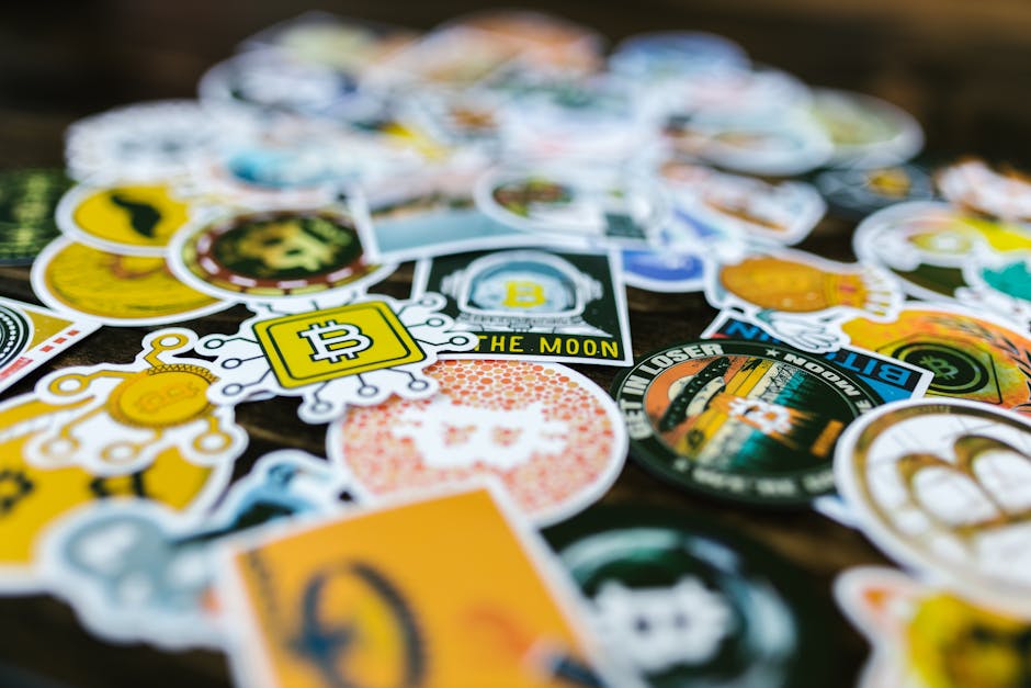 Vibrant Bitcoin and cryptocurrency-themed stickers scattered on a surface.